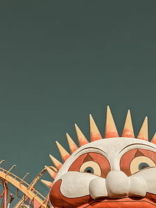 close up photo of white and orange clown themed park thumbnail