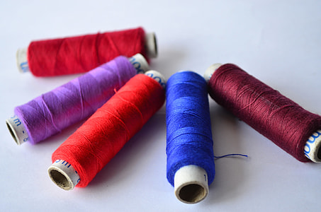 sewing thread rolls in white surface thumbnail