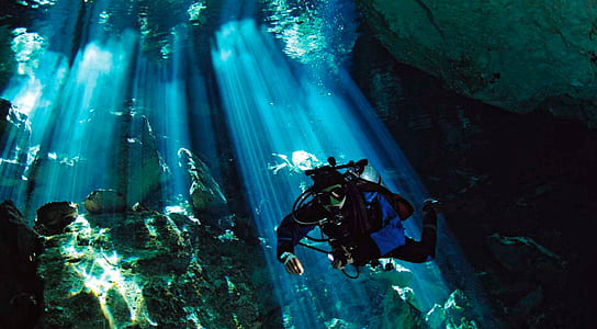 person diving underwater with sunlight thumbnail