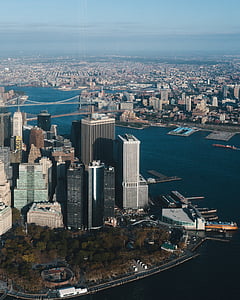 bird's-eye view photography of city buildings near body of water thumbnail