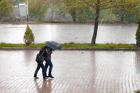 two person under umbrella during rain thumbnail
