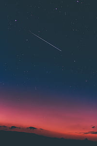 photo of shooting star on top of mountain thumbnail