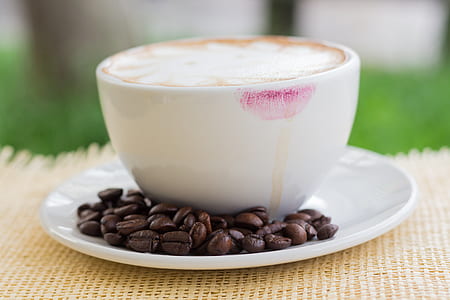 selective focus photography of latte cup with kiss mark thumbnail