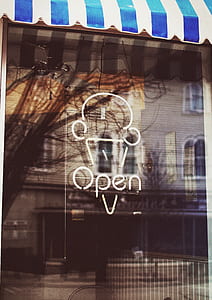white Open neon signage on black glass panel thumbnail