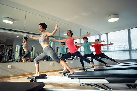 women doing exercise inside room thumbnail