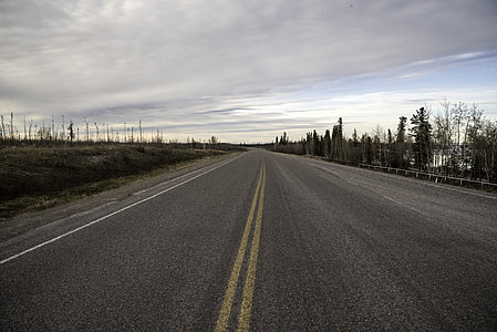Road under the clouds thumbnail