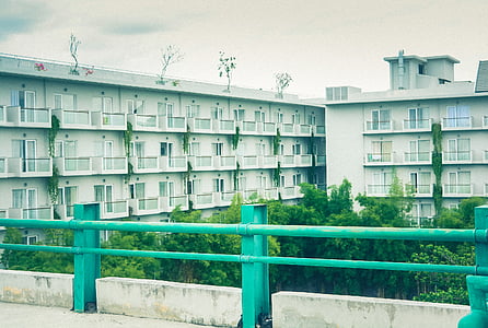 green metal rails near buildings thumbnail