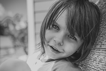 grayscale photo of girl leaning on something thumbnail