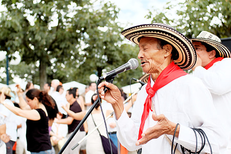 man singing with people dancing outdoor thumbnail