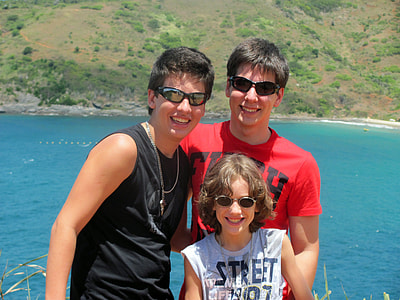 group of three takes groupie near body of water thumbnail