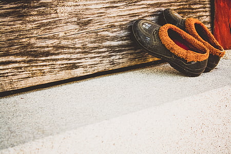 pair of brown shoes on gray floor thumbnail