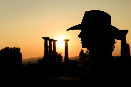 silhouette photography of person wearing cowboy hat thumbnail