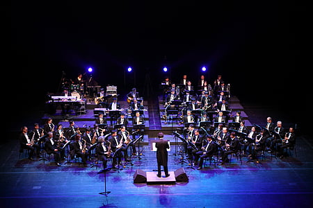 musicians playing on stage with spotlight thumbnail