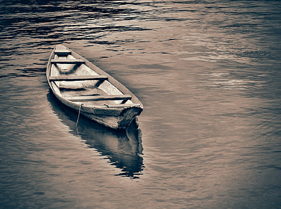 brown boat on water thumbnail