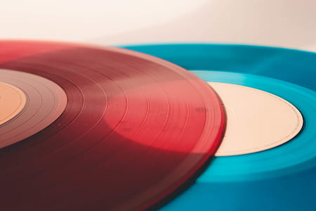 closed up photo of red and blue vinyl records thumbnail