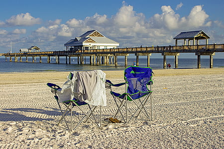 two blue folding armchair near beach thumbnail