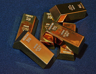 six gold bars on black surface thumbnail