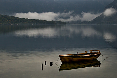boat parked on body of water thumbnail
