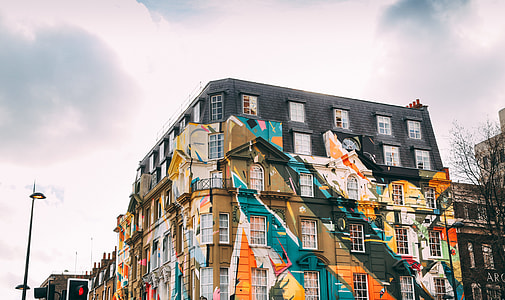 multicolored high-ride building under white sky thumbnail