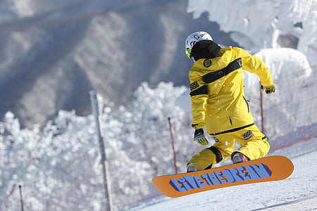 person with snowboard during daytime thumbnail
