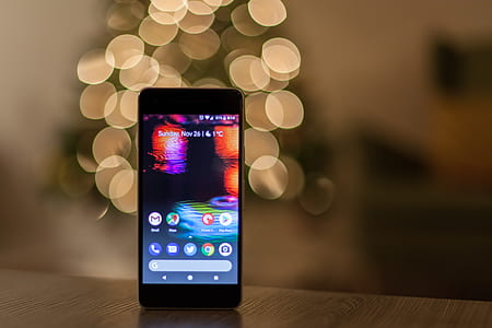 Android smartphone on wooden table thumbnail