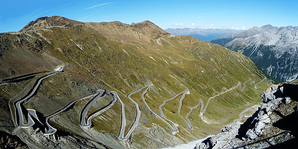 aerial shot of mountain under blue skies thumbnail