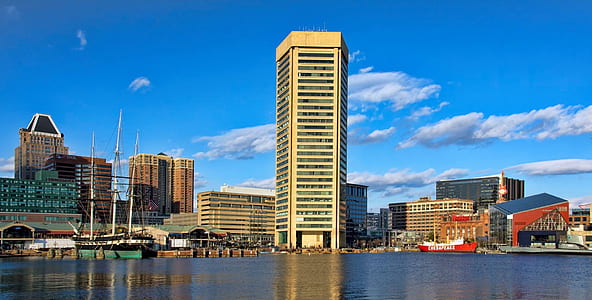 several buildings near body of water thumbnail