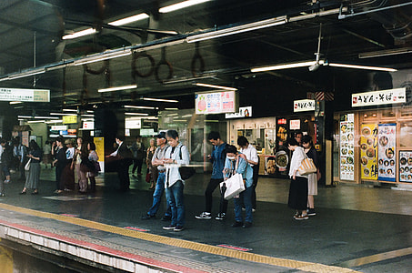 people standing on train station thumbnail