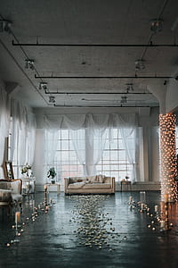 beige fabric couch at the back of white window curtain thumbnail