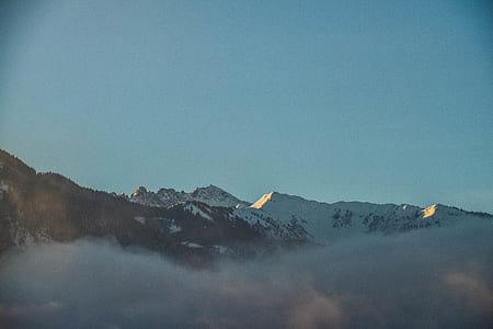 mountain with snow during daytime thumbnail