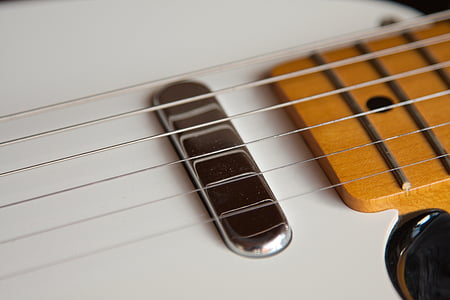 macro shot photography of guitar strings thumbnail