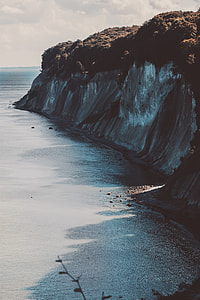 painting of seashore and cliff thumbnail