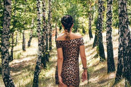 photo of woman wearing leopard print bodycon off-shoulder dress thumbnail