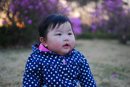 baby wearing polka dot hoodie thumbnail