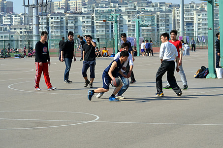 group of men playing basketball thumbnail