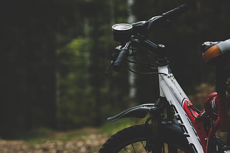 white and red mountain bike during daytime thumbnail
