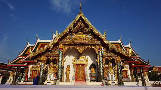 white and brown pagoda under blue sky thumbnail