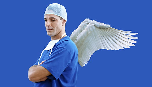 man with arms crossed and wings at the back thumbnail