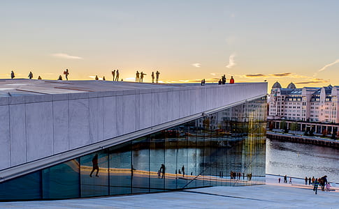 people standing on top of building during sunrise thumbnail