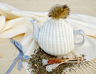 white ceramic teapot on textile thumbnail