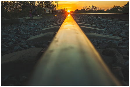 train rail during sunset thumbnail