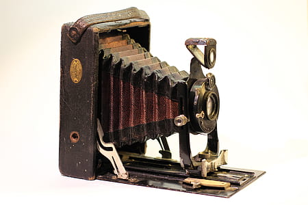 brown and black folding camera thumbnail