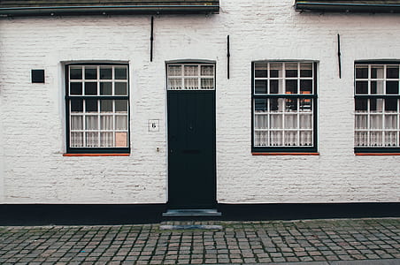 closed door and window concrete house at daytime thumbnail