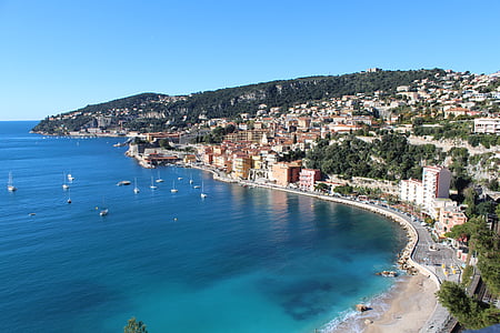 buildings near sea during daytime thumbnail