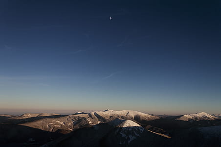 gray mountain under clear blue sky thumbnail