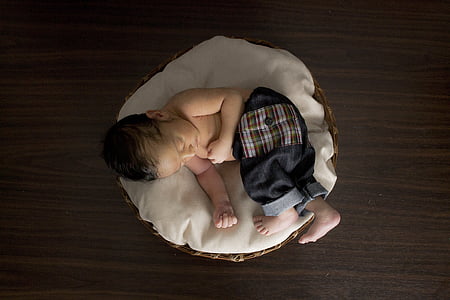 baby sleeping on cushion thumbnail