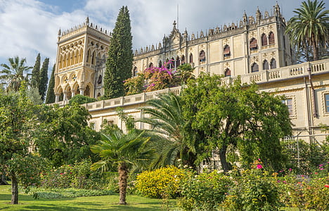beige palace surrounded by plants thumbnail