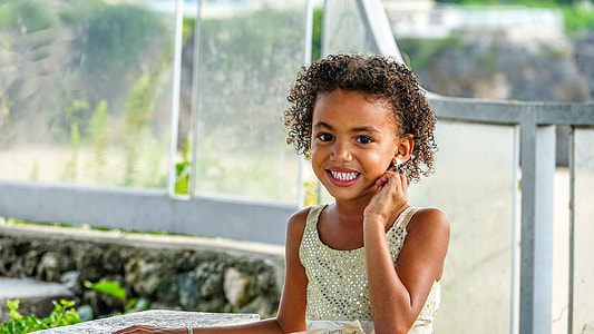 girl sitting on chair while smiling thumbnail