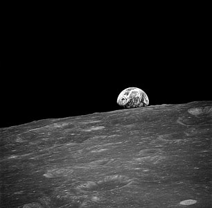 gray scale photo of earth as viewed from the moon's surface thumbnail