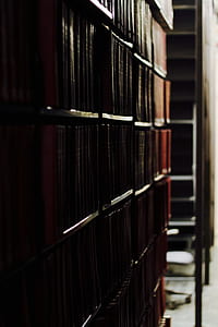 brown wooden shelves filled with books thumbnail
